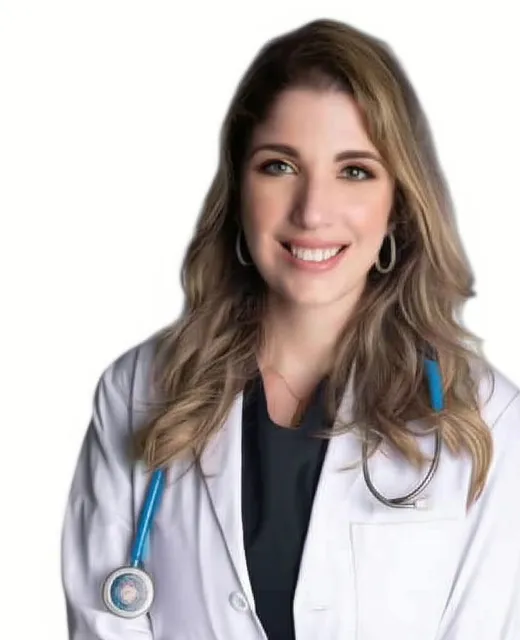 Dr. Bryanna Hubbard, DDS smiling in dental scrubs